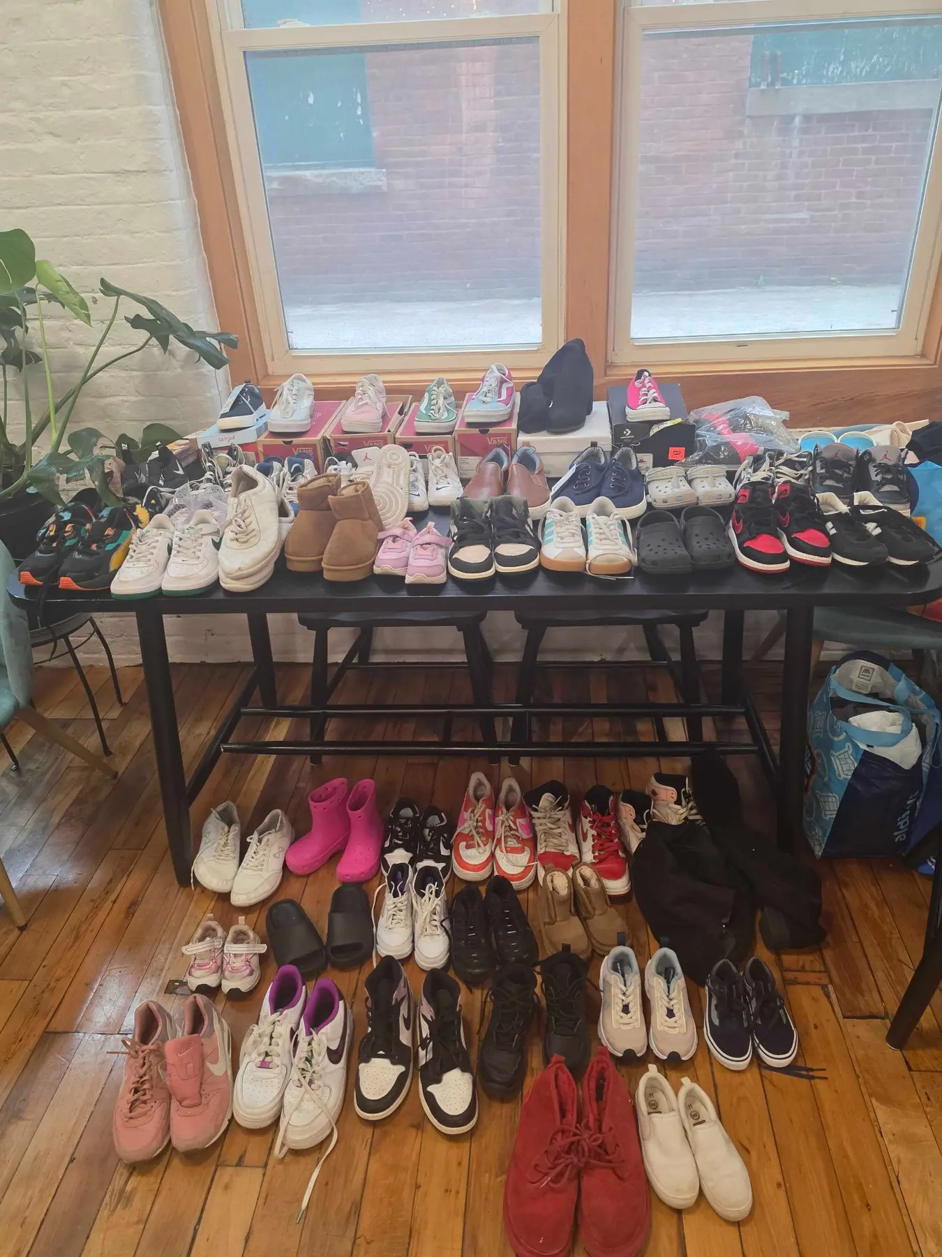 Many pairs of donated children's shoes